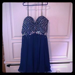 Formal blue dress with diamonds and a tie up back